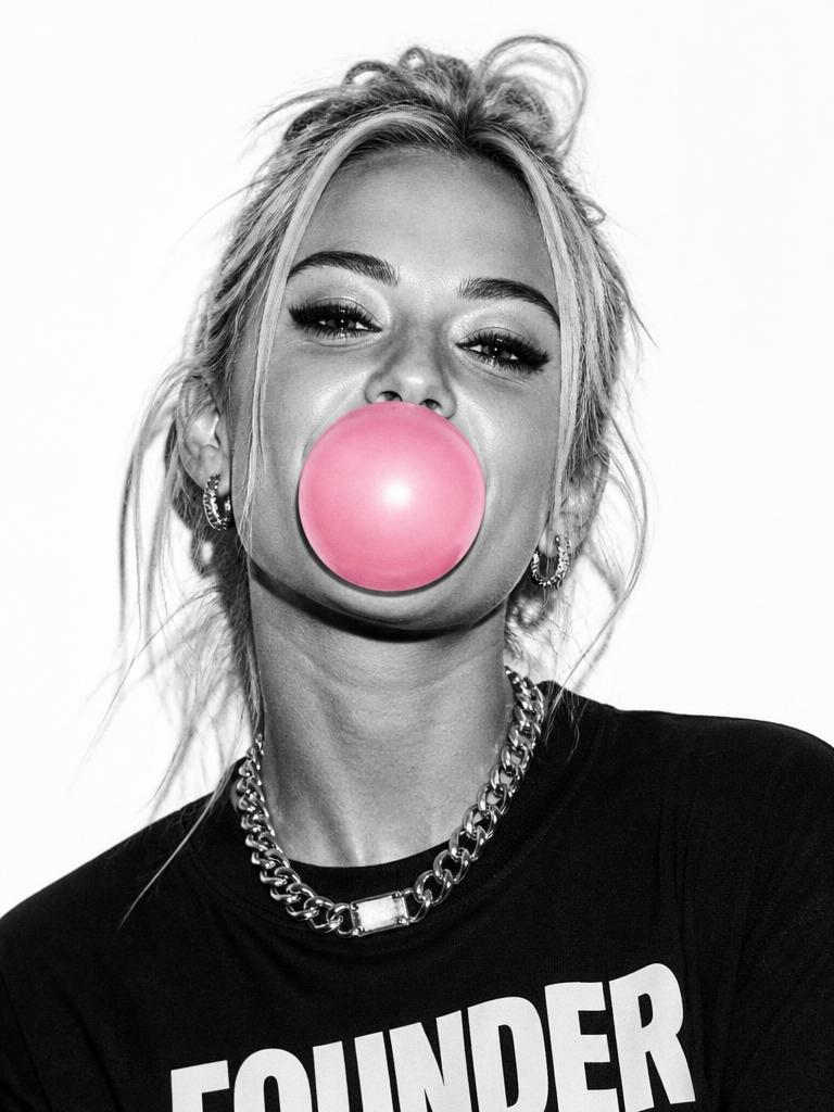 Confident founder blowing a bubblegum pink bubble
